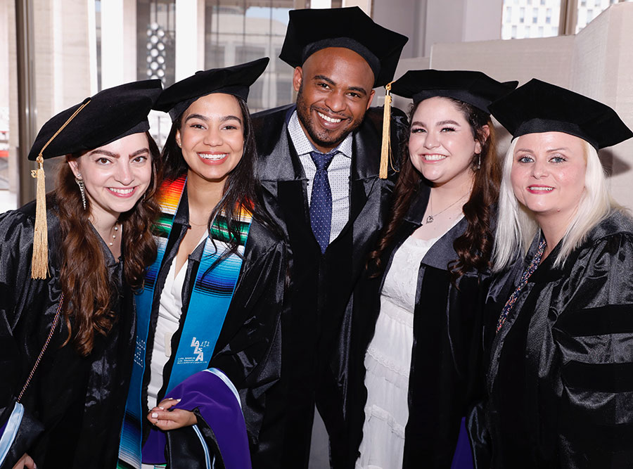 Happy students with mortarboards